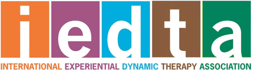 Logo of the International Experiential Dynamic Therapy Association (IEDTA): the letters i, e, d, t, a in colored squares.